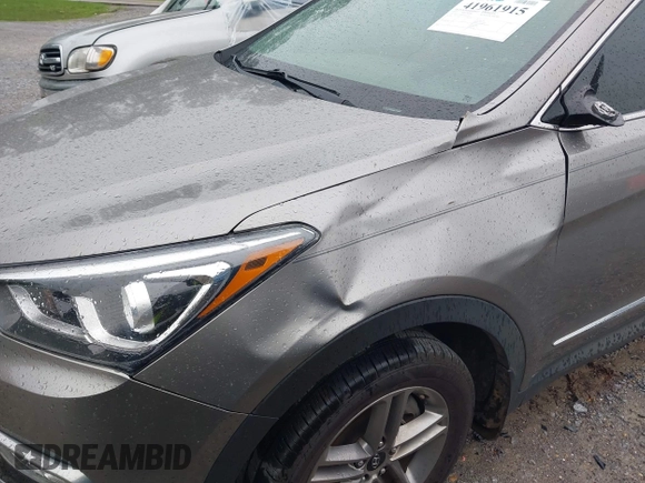 2017 Hyundai Santa Fe 2.4L z VIN 5XYZU3LB8HG421397, wystawiony jako IAAI lot #41961915 z przebiegiem 102 594 mil mil oraz . Historia ofert i sprzedaży dostępna na DreamBid. Obrazek 6.