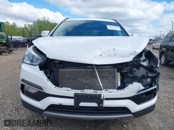 2018 Hyundai Santa Fe 2.4L z VIN 5NMZUDLB1JH101842, wystawiony jako IAAI lot #42302237 z przebiegiem 97 376 mil mil oraz . Historia ofert i sprzedaży dostępna na DreamBid. Obrazek 13.