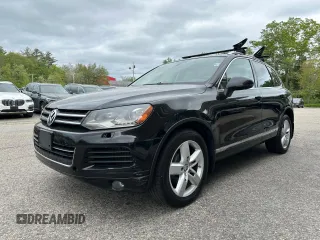 2013 Volkswagen Touareg Exec z VIN WVGEP9BP8DD005795, wystawiony jako Copart lot #58057105 z przebiegiem 202 563 mil mil oraz Czysty tytuł • Clean title. Historia ofert i sprzedaży dostępna na DreamBid. Obrazek 2.