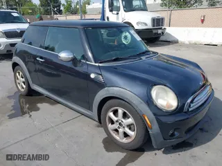 2009 MINI Cooper Hardtop with VIN WMWMF33589TW70400, listed as a IAAI auction lot 42055596 with 118,543 mi miles. Bid and sale history available at carsss.com. Image 1.