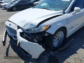 2016 Ford Fusion Energi SE Luxury with VIN 3FA6P0PU7GR206589, listed as a IAAI auction lot 42002565 with 215,789 mi miles. Bid and sale history available at carsss.com. Image 12.