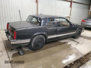 1988 Cadillac Eldorado z VIN 1G6EL1154JU615807, wystawiony jako Copart lot #76362924 z przebiegiem Nie podano mil oraz Tytuł czysty. Historia ofert i sprzedaży dostępna na DreamBid. Obrazek 3.