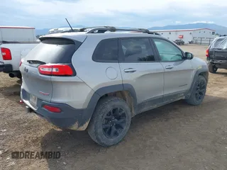2015 Jeep Cherokee Trailhawk with VIN 1C4PJMBS0FW522182, listed as a IAAI auction lot 42544508 with 74,910 mi miles and . Bid and sale history available at DreamBid. Image 4.