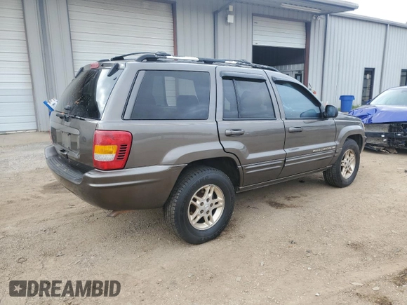 1999 Jeep Grand Cherokee Limited with VIN 1J4G268S3XC728805, listed as a Copart auction lot 79878974 with 206,768 mi miles and Salvage title. Bid and sale history available at DreamBid. Image 3.