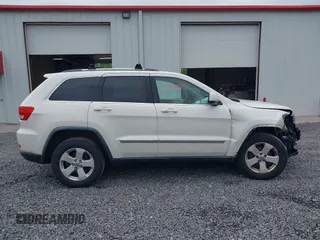 2011 Jeep Grand Cherokee Laredo with VIN 1J4RR4GG6BC680943, listed as a IAAI auction lot 42419575 with 188,672 mi miles and . Bid and sale history available at DreamBid. Image 13.