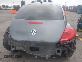 2013 Volkswagen Beetle 2.5L with VIN 3VWJP7AT6DM667477, listed as a IAAI auction lot 42215545 with 87,392 mi miles and . Bid and sale history available at DreamBid. Image 16.