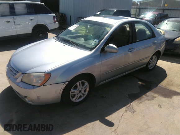 2005 Kia Spectra LX with VIN KNAFE121055121500, listed as a IAAI auction lot 39677018 with 142,307 mi miles. Bid and sale history available at carsss.com. Image 2.