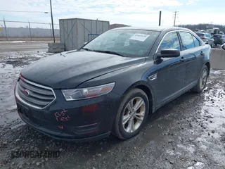 2013 Ford Taurus SEL with VIN 1FAHP2E86DG135835, listed as a IAAI auction lot 41665430 with 130,816 mi miles. Bid and sale history available at carsss.com. Image 2.