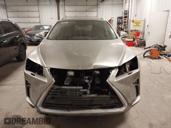 2018 Lexus RX 350L Premium z VIN JTJDZKCA6J2004385, wystawiony jako IAAI lot #41382429 z przebiegiem 111 638 mil mil oraz . Historia ofert i sprzedaży dostępna na DreamBid. Obrazek 13.