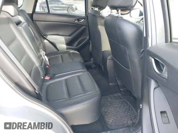 2014 Mazda CX-5 Grand Touring with VIN JM3KE2DY8E0304911, listed as a IAAI auction lot 41672197 with 77,523 mi miles. Bid and sale history available at carsss.com. Image 8.