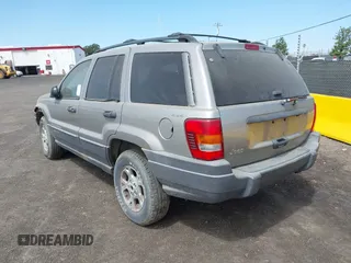 2001 Jeep Grand Cherokee Laredo with VIN 1J4GW48S11C503427, listed as a IAAI auction lot 40004360 with 232,712 mi miles and . Bid and sale history available at DreamBid. Image 3.