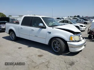 2001 Ford F-150 XLT with VIN 1FTRW07651KC49772, listed as a Copart auction lot 59904815 with 145,639 mi miles and Salvage title. Bid and sale history available at DreamBid. Image 4.