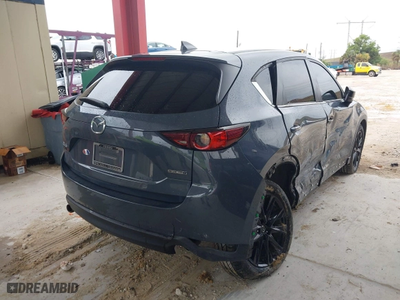 2021 Mazda CX-5 Touring with VIN JM3KFACM0M0327832, listed as a IAAI auction lot 41989199 with 42,396 mi miles. Bid and sale history available at carsss.com. Image 4.