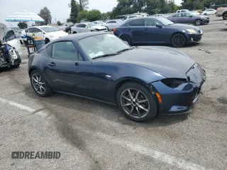 2021 Mazda MX-5 Miata Grand Touring with VIN JM1NDAM70M0460532, listed as a Copart auction lot 58828045 with 70,269 mi miles and Salvage title. Bid and sale history available at DreamBid. Image 4.