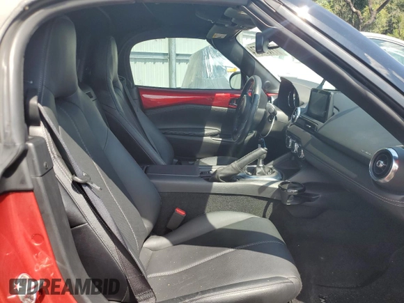 2020 Mazda MX-5 Miata Grand Touring z VIN JM1NDAD79L0415751, wystawiony jako Copart lot #71864574 z przebiegiem Nie podano mil oraz Szkoda całkowita • Salvage title. Historia ofert i sprzedaży dostępna na DreamBid. Obrazek 10.