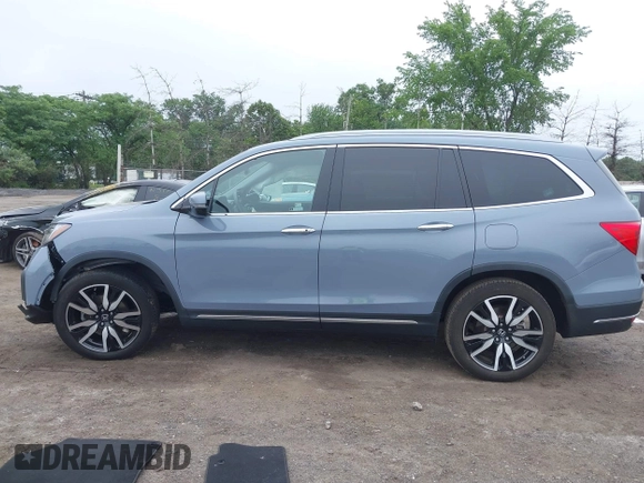 2022 Honda Pilot Touring 7-Passenger with VIN 5FNYF6H68NB056077, listed as a IAAI auction lot 42357338 with 18,193 mi miles and . Bid and sale history available at DreamBid. Image 14.