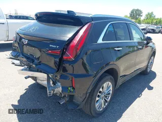 2024 Cadillac XT4 AWD Premium Luxury z VIN 1GYFZDR44RF144801, wystawiony jako IAAI lot #42646613 z przebiegiem 37 358 mil mil oraz . Historia ofert i sprzedaży dostępna na DreamBid. Obrazek 4.