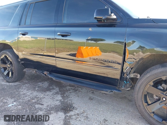 2019 Chevrolet Suburban Premier with VIN 1GNSKJKJ1KR100936, listed as a IAAI auction lot 40489121 with 97,884 mi miles and . Bid and sale history available at DreamBid. Image 6.