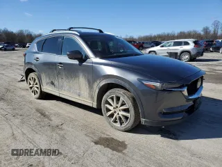 2018 Mazda CX-5 Grand Touring with VIN JM3KFBDM2J0407164, listed as a Copart auction lot 50080345 with 126,464 mi miles and Salvage title. Bid and sale history available at DreamBid. Image 4.