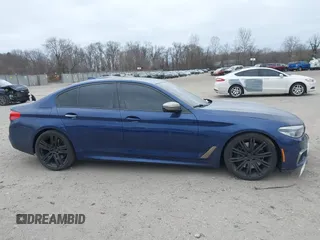 2018 BMW 5 Series M550i xDrive with VIN WBAJB9C56JG463891, listed as a IAAI auction lot 41731556 with 104,860 mi miles. Bid and sale history available at carsss.com. Image 13.
