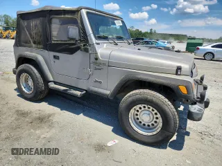 2001 Jeep Wrangler Sport with VIN 1J4FA49S21P374356, listed as a Copart auction lot 63568695 with 202,853 mi miles and Clean title. Bid and sale history available at DreamBid. Image 4.