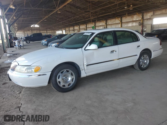 2001 Lincoln Continental with VIN 1LNHM97V31Y622782, listed as a Copart auction lot 74023344 with 116,672 mi miles and Salvage Title. Bid and sale history available at carsss.com. Image 1.
