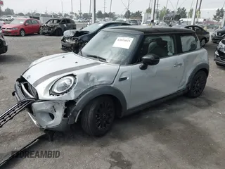 2021 MINI Hardtop Cooper with VIN WMWXR3C09M2N96671, listed as a IAAI auction lot 42031023 with 12,450 mi miles and . Bid and sale history available at DreamBid. Image 2.
