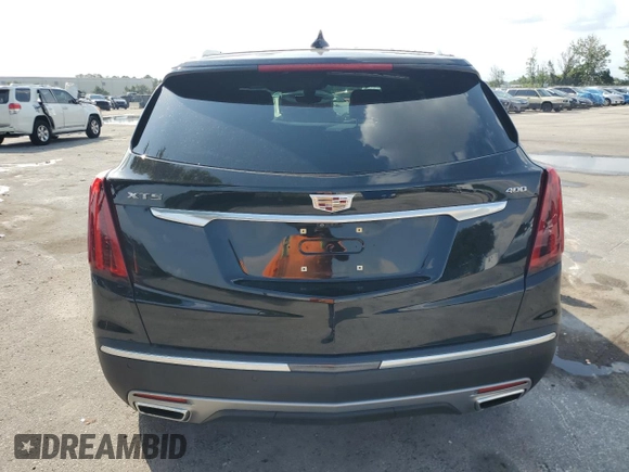2022 Cadillac XT5 FWD Premium Luxury z VIN 1GYKNCRS7NZ101131, wystawiony jako Copart lot #56365065 z przebiegiem 74 168 mil mil oraz Szkoda całkowita • Salvage title. Historia ofert i sprzedaży dostępna na DreamBid. Obrazek 6.