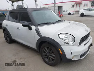 2011 MINI Countryman S z VIN WMWZC3C52BWL78647, wystawiony jako IAAI lot #42459886 z przebiegiem 142 407 mil mil oraz . Historia ofert i sprzedaży dostępna na DreamBid. Obrazek 1.