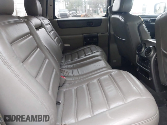 2003 Hummer H2 with VIN 5GRGN23U73H142389, listed as a IAAI auction lot 42219627 with 78,547 mi miles. Bid and sale history available at carsss.com. Image 8.