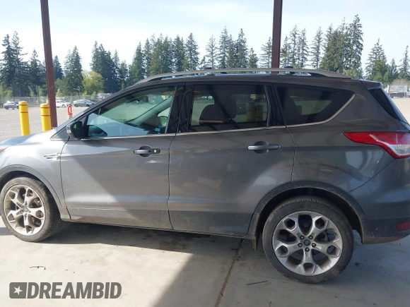 2014 Ford Escape Titanium with VIN 1FMCU9JX0EUC45801, listed as a IAAI auction lot 42121561 with 80,217 mi miles and . Bid and sale history available at DreamBid. Image 14.