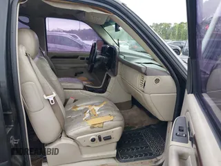 2003 Cadillac Escalade z VIN 1GYEK63N73R203813, wystawiony jako IAAI lot #42138841 z przebiegiem 68 483 mil mil oraz . Historia ofert i sprzedaży dostępna na DreamBid. Obrazek 5.