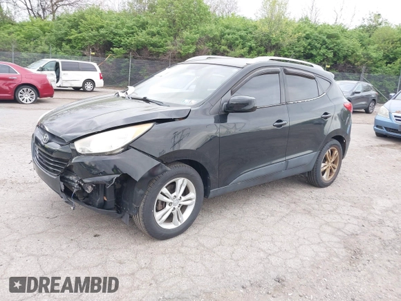2011 Hyundai Tucson Limited with VIN KM8JUCACXBU293660, listed as a IAAI auction lot 42051931 with 99,995 mi miles and . Bid and sale history available at DreamBid. Image 2.