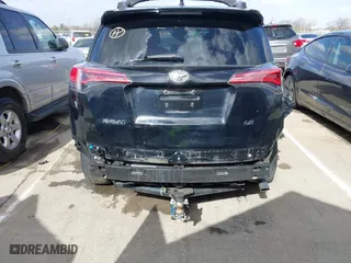 2018 Toyota RAV4 LE with VIN 2T3ZFREV9JW457062, listed as a IAAI auction lot 41696609 with 96,716 mi miles. Bid and sale history available at carsss.com. Image 17.