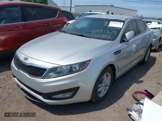 2012 Kia Optima LX with VIN KNAGM4A70C5280464, listed as a IAAI auction lot 41881578 with 141,494 mi miles. Bid and sale history available at carsss.com. Image 2.