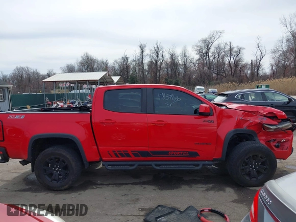 2018 Chevrolet Colorado 4WD Z71 z VIN 1GCGTDEN8J1141945, wystawiony jako IAAI lot #41837680 z przebiegiem 67 686 mil mil oraz . Historia ofert i sprzedaży dostępna na DreamBid. Obrazek 13.