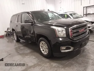 2016 GMC Yukon XL SLE with VIN 1GKS2FKC5GR173343, listed as a IAAI auction lot 41249784 with 122,446 mi miles. Bid and sale history available at carsss.com. Image 1.