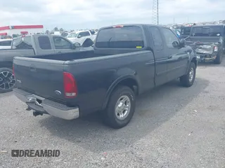 1999 Ford F-150 XL with VIN 1FTRX18L3XNA05021, listed as a IAAI auction lot 42138727 with 1 mi miles. Bid and sale history available at carsss.com. Image 4.
