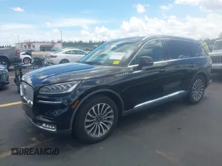 2021 Lincoln Aviator Reserve with VIN 5LM5J7WC0MGL12385, listed as a IAAI auction lot 42472422 with 20,404 mi miles and . Bid and sale history available at DreamBid. Image 2.
