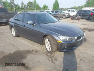 2013 BMW 3 Series 328i xDrive with VIN WBA3B3C53DJ810249, listed as a IAAI auction lot 42099473 with 125,255 mi miles. Bid and sale history available at carsss.com. Image 1.