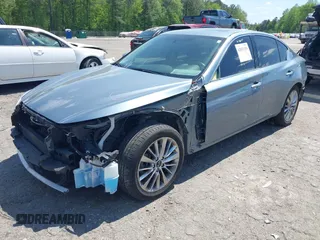 2020 Infiniti Q50 Luxe z VIN JN1EV7AP9LM207501, wystawiony jako IAAI lot #42033154 z przebiegiem 98 670 mil mil oraz . Historia ofert i sprzedaży dostępna na DreamBid. Obrazek 2.