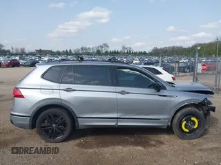 2022 Volkswagen Tiguan SE R-Line Black with VIN 3VV8B7AX7NM030703, listed as a IAAI auction lot 42135974 with 57,116 mi miles and . Bid and sale history available at DreamBid. Image 14.