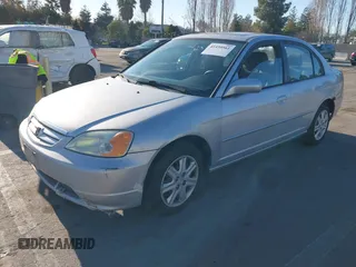 2003 Honda Civic EX with VIN 1HGES25773L003015, listed as a IAAI auction lot 41450561 with 228,620 mi miles. Bid and sale history available at carsss.com. Image 2.