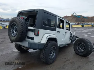 2015 Jeep Wrangler Unlimited Sahara with VIN 1C4BJWEG5FL518191, listed as a IAAI auction lot 41914581 with 107,433 mi miles. Bid and sale history available at carsss.com. Image 4.
