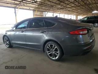 2020 Ford Fusion SEL z VIN 3FA6P0CD3LR131180, wystawiony jako Copart lot #63843355 z przebiegiem 146 705 mil mil oraz Czysty tytuł • Clean title. Historia ofert i sprzedaży dostępna na DreamBid. Obrazek 2.