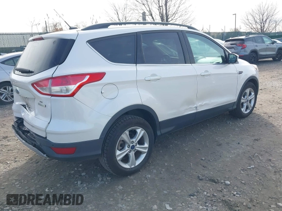 2014 Ford Escape SE with VIN 1FMCU0GX1EUB23743, listed as a IAAI auction lot 40893420 with 74,506 mi miles. Bid and sale history available at carsss.com. Image 4.