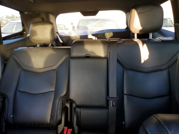 2023 Cadillac XT6 FWD Premium Luxury z VIN 1GYKPCRS7PZ105628, wystawiony jako Copart lot #84841124 z przebiegiem Nie podano mil oraz Szkoda całkowita • Salvage title. Historia ofert i sprzedaży dostępna na DreamBid. Obrazek 10.