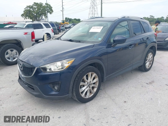 2014 Mazda CX-5 Grand Touring with VIN JM3KE2DY8E0425258, listed as a IAAI auction lot 42179452 with 132,137 mi miles. Bid and sale history available at carsss.com. Image 2.