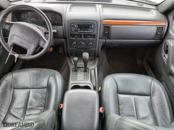 1999 Jeep Grand Cherokee Laredo with VIN 1J4GW58SXXC553547, listed as a Copart auction lot 50786405 with 151,968 mi miles and Salvage Title. Bid and sale history available at carsss.com. Image 8.