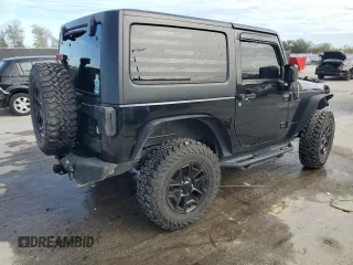 2017 Jeep Wrangler Willys Wheeler with VIN 1C4AJWAG1HL624254, listed as a Copart auction lot 42678975 with 51,936 mi miles and Salvage Title. Bid and sale history available at DreamBid. Image 3.